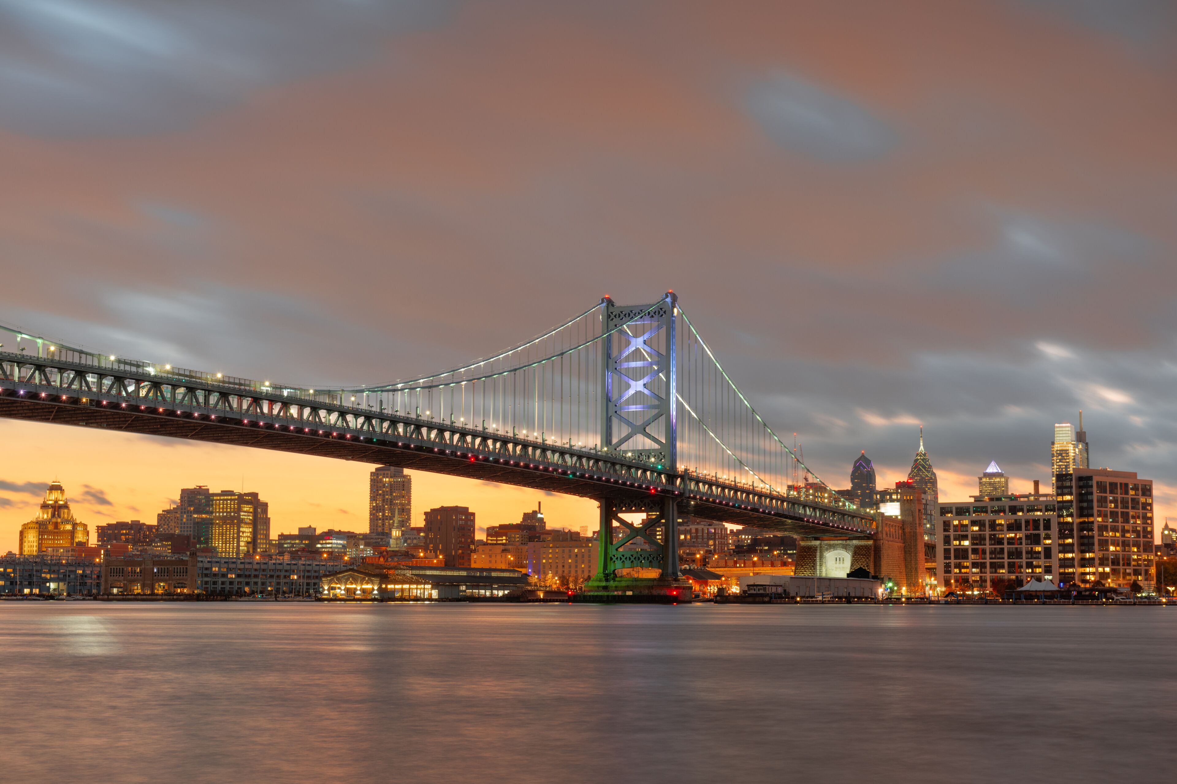 Philadelphia, Pennsylvania, USA skyline on the Delaware river with Ben Franklin Bridge