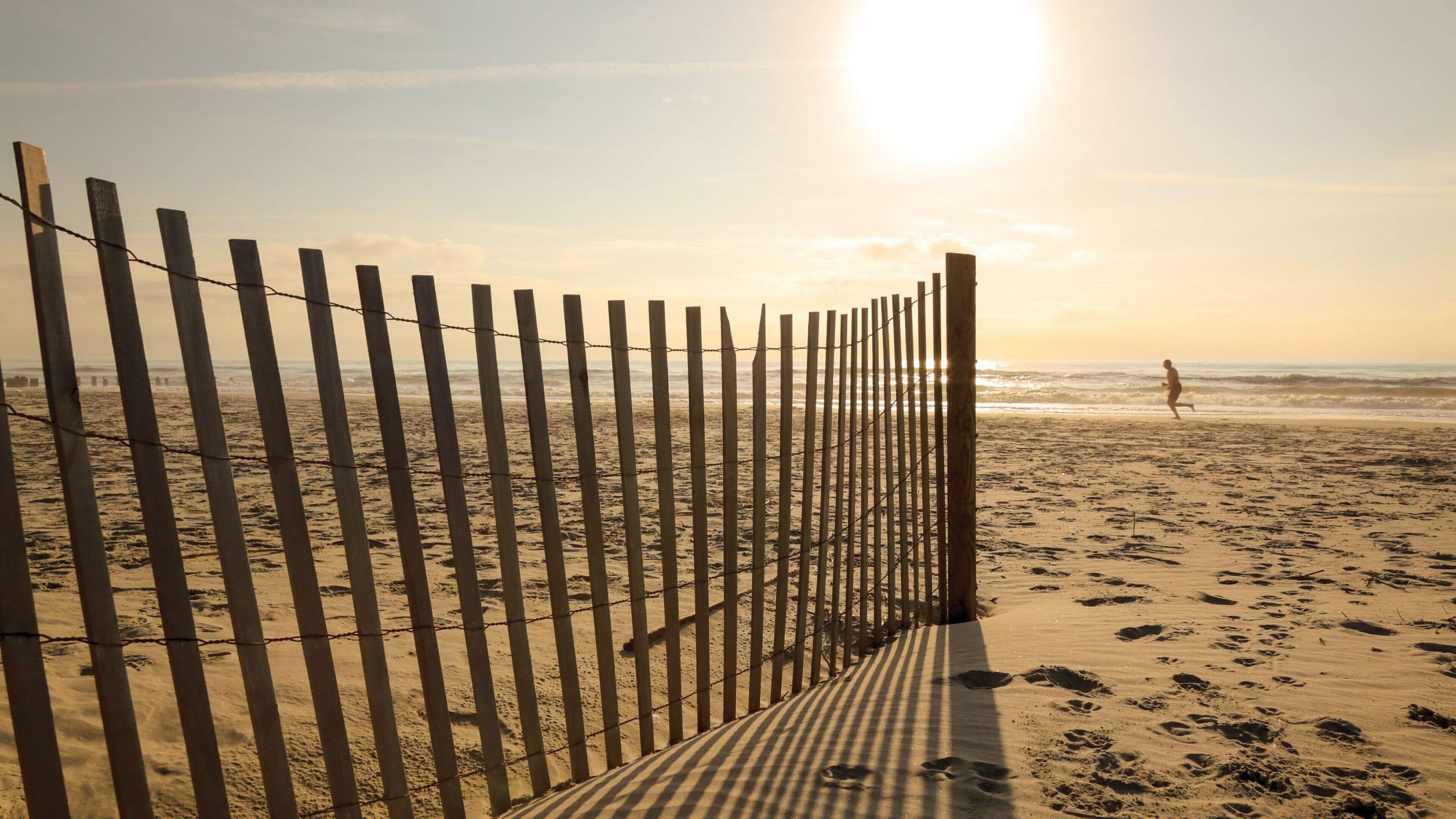 Folly Beach featuring general coastal views, a sunset and a sandy beach