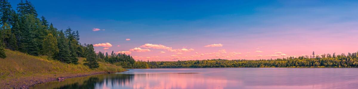 Colorful fantasy lake landscape and cloudscape over Town of Truro Reservoir at Victoria Park in Truro, Nova Scotia, Canada