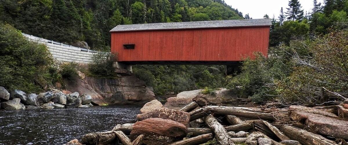 The current Point Wolfe covered bridge in Fundy National Park is actually a replacement built in 1992 when the previous bridge was badly damaged in a construction mishap. This covered bridge is 29 m (94 ft.) in length. (September 2017)
Driving directions:
Route 1, Exit 211, Route 114 South for 41.5 km (25.7 mi.), onto Point Wolfe Road in Fundy National Park.