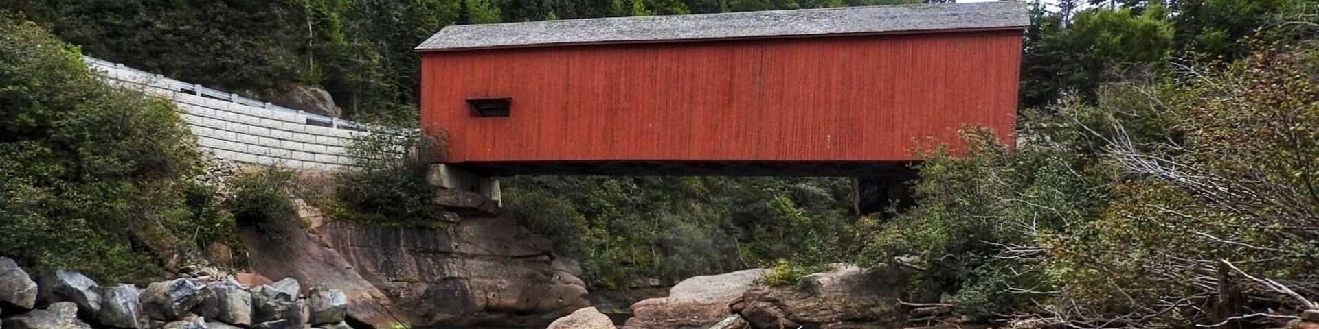The current Point Wolfe covered bridge in Fundy National Park is actually a replacement built in 1992 when the previous bridge was badly damaged in a construction mishap. This covered bridge is 29 m (94 ft.) in length. (September 2017)
Driving directions:
Route 1, Exit 211, Route 114 South for 41.5 km (25.7 mi.), onto Point Wolfe Road in Fundy National Park.