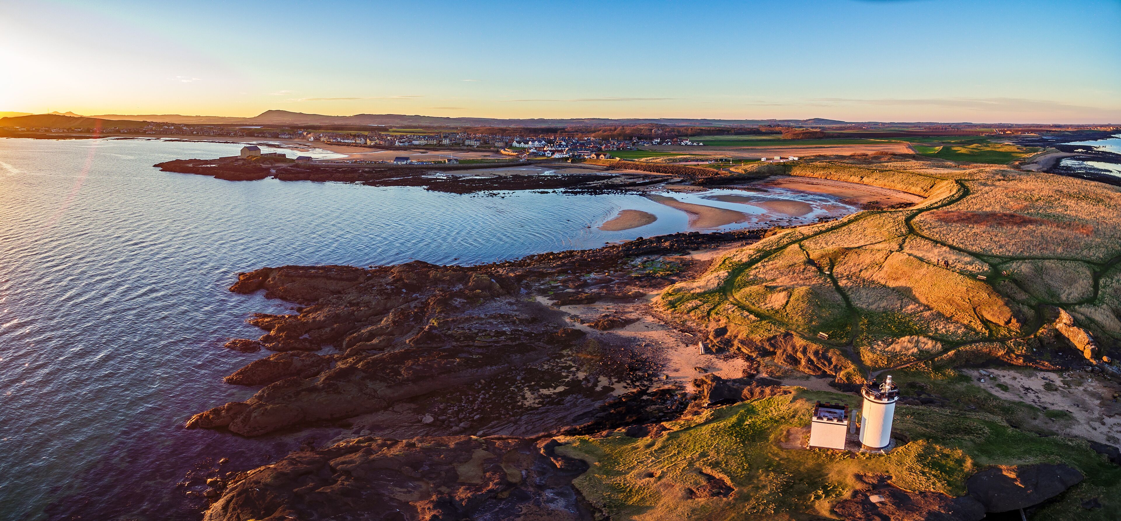 Aerial view of Elie Ness Lighthouse at sunset on the coast of The Kingdom of Fife. Scotland, UK