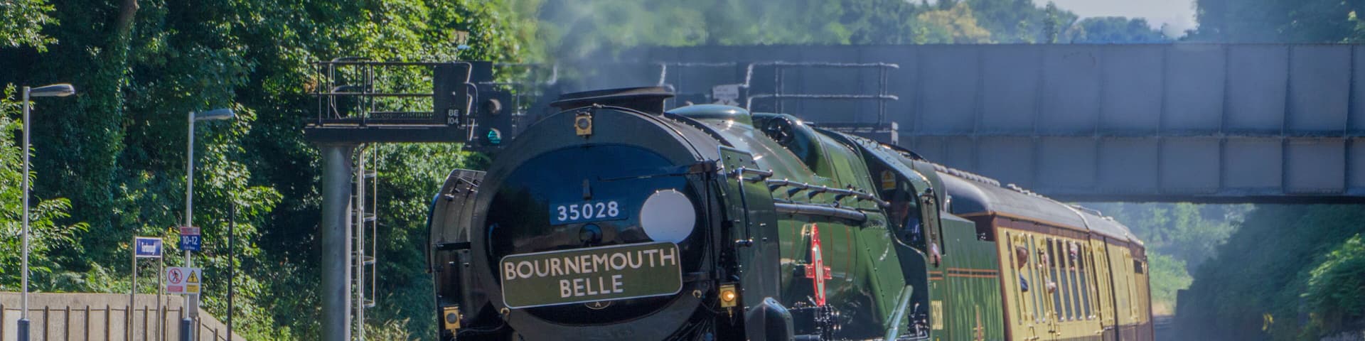 Clan Line. A Merchant Navy Class Steam locomotive speeds through Farnborough Station , Hampshire on 5th July, 2017. with The Bournemouth Belle
