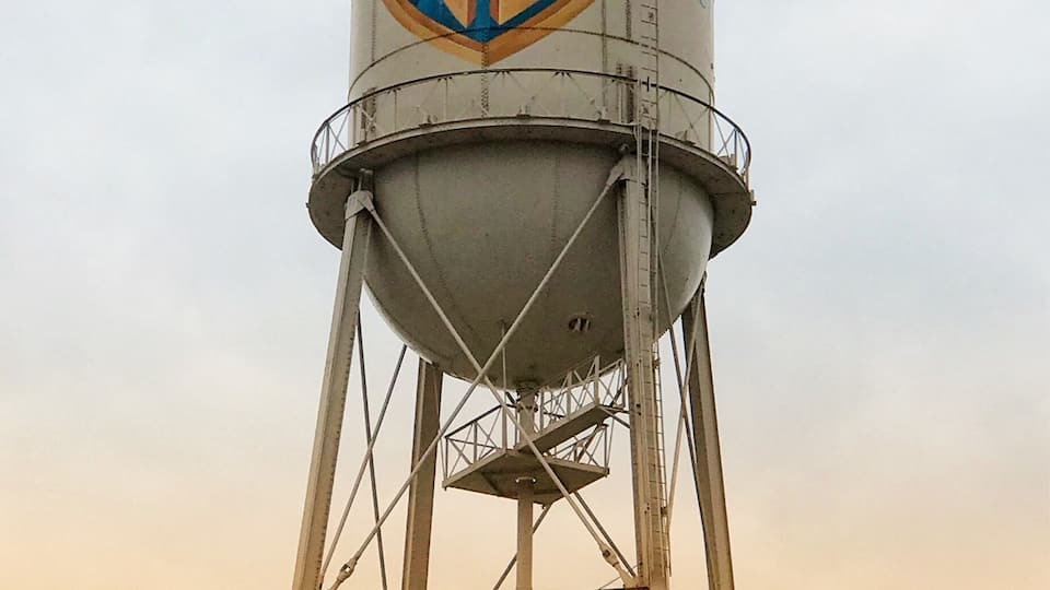 A water tower with Warner Bros. Studios logo.