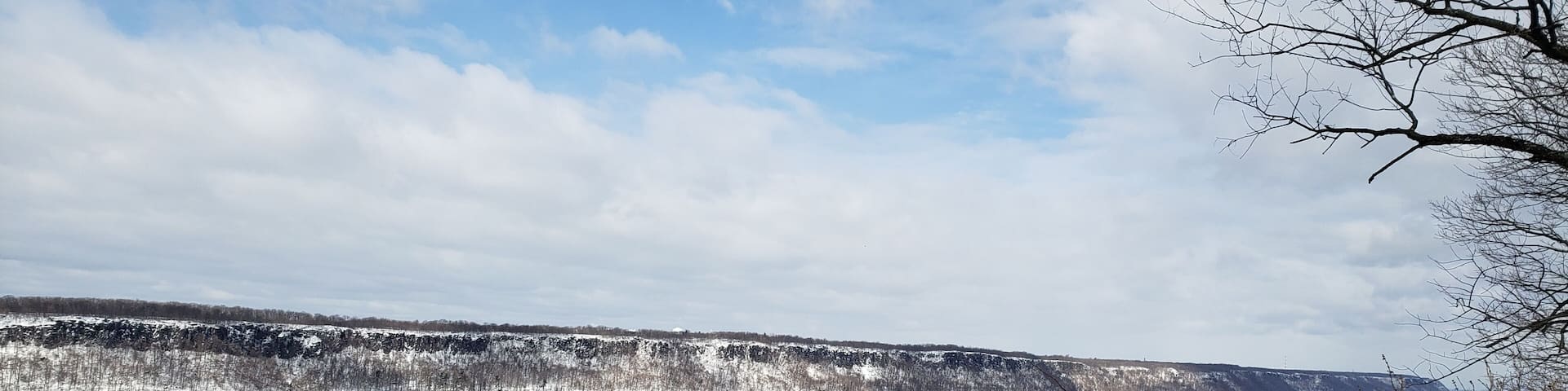 Winter landscape overlooking the Hudson River towards from Inwood Hill Park in Manhattan to the Palisades Park in New Jersey