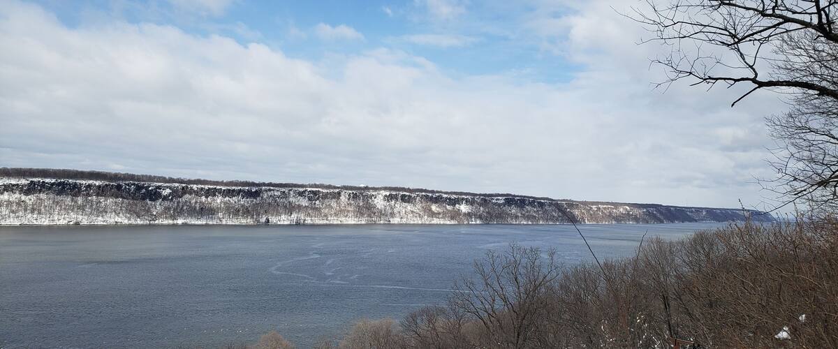 Winter landscape overlooking the Hudson River towards from Inwood Hill Park in Manhattan to the Palisades Park in New Jersey