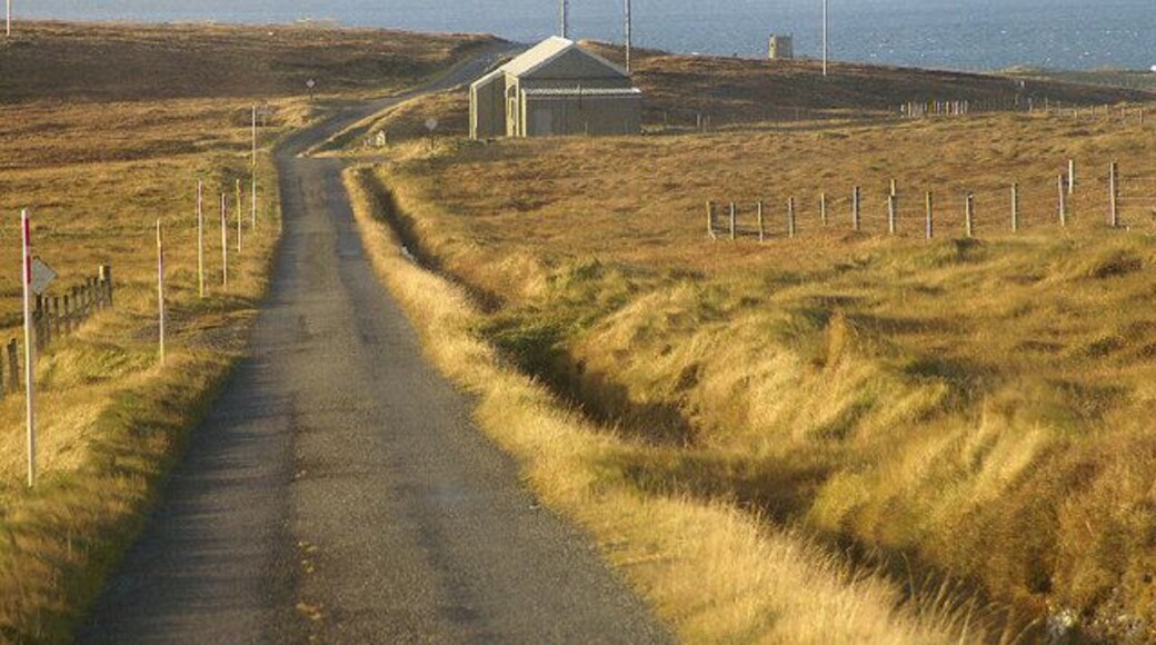 Fetlar Telephone Exchange This is the main road through Fetlar. The tower folly beside Brough Lodge can be seen in the distance.