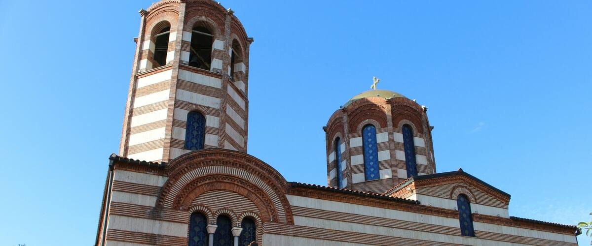 A church with two towers and a dome.