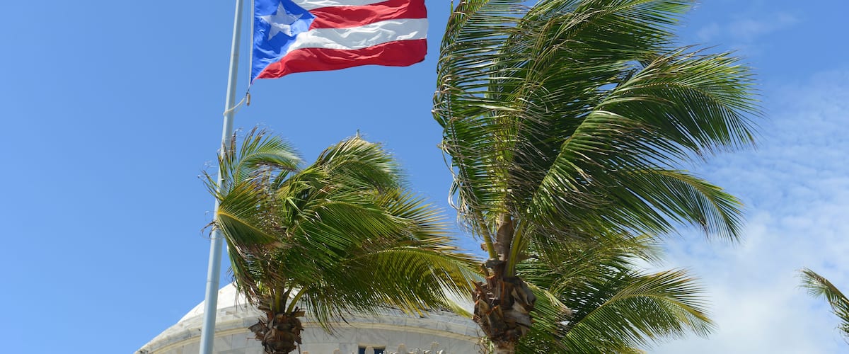 Flag of the Commonwealth of Puerto Rico in front of Capitolio, San Juan, Puerto Rico.