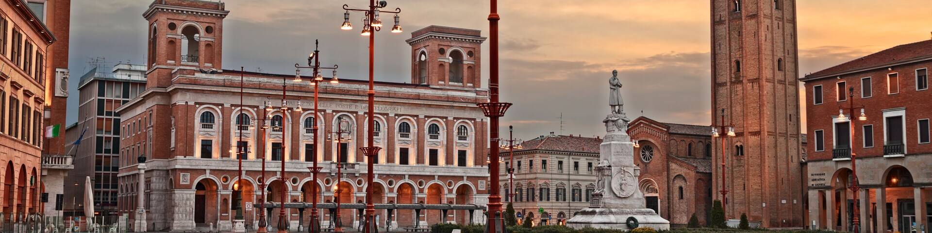 Forli, Emilia-Romagna, Italy: the main square Aurelio Saffi with the ancient abbey of San Mercuriale and the post office building of 1932