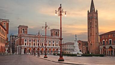 Forli, Emilia-Romagna, Italy: the main square Aurelio Saffi with the ancient abbey of San Mercuriale and the post office building of 1932