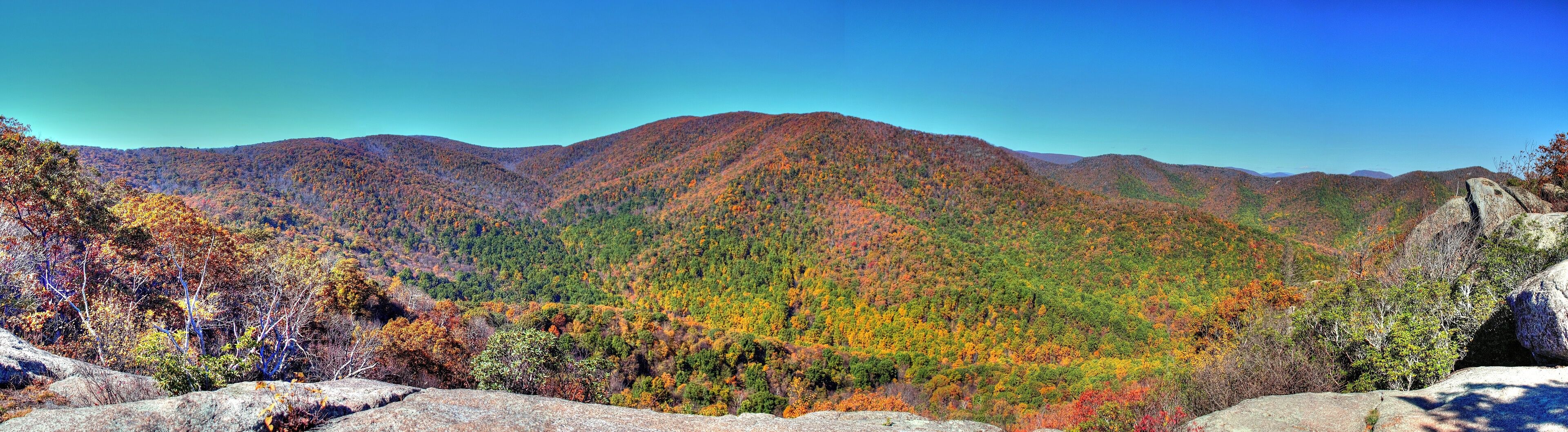 A mountain range with autumn foliage.