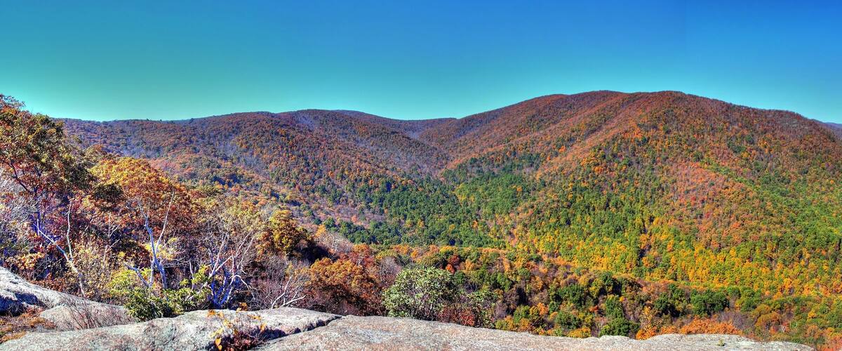A mountain range with autumn foliage.