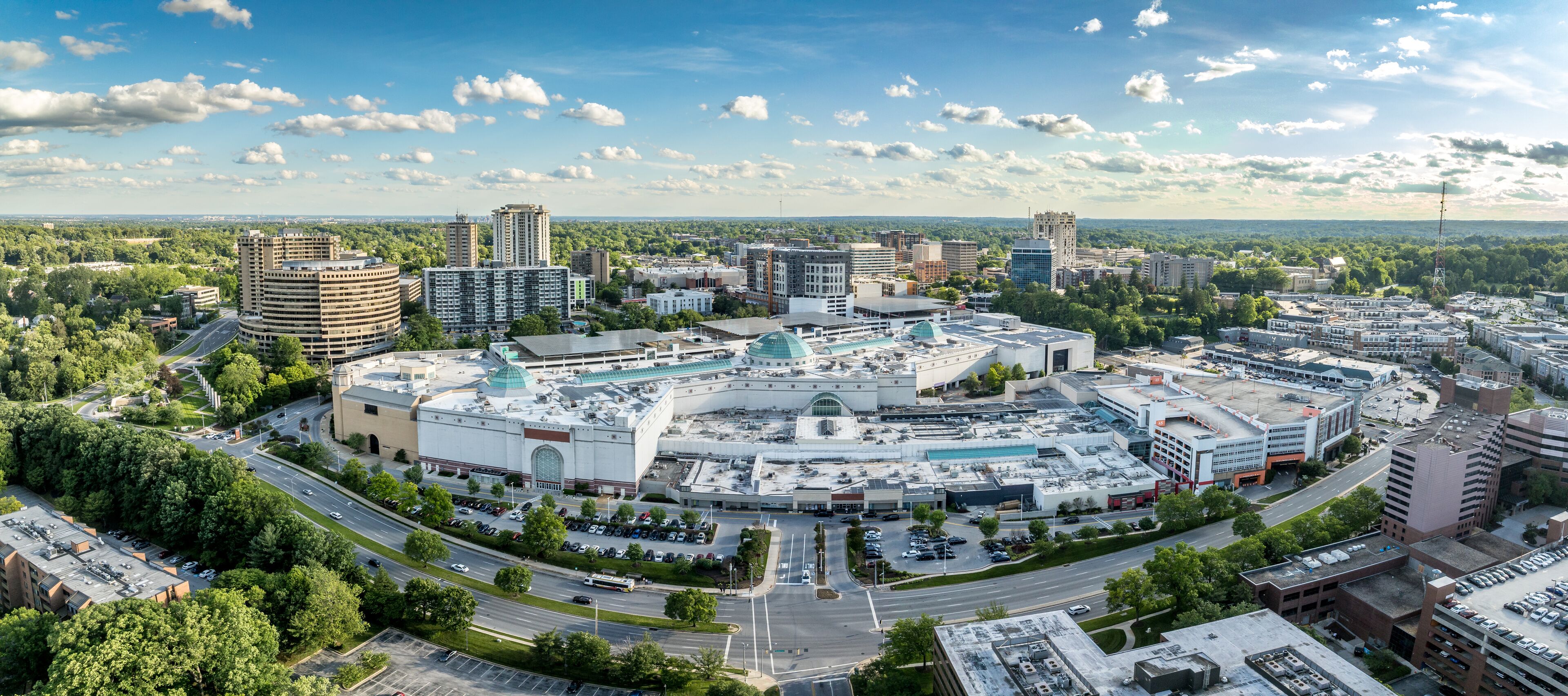 Aerial View: Towson Town Center, a prominent retail and lifestyle hub in Towson, Maryland with cloudy blue sky