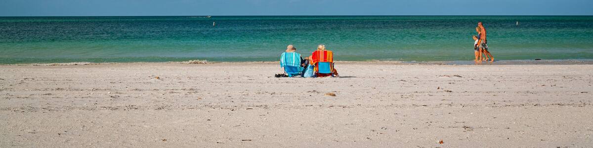 Treasure Island featuring general coastal views and a sandy beach as well as a couple