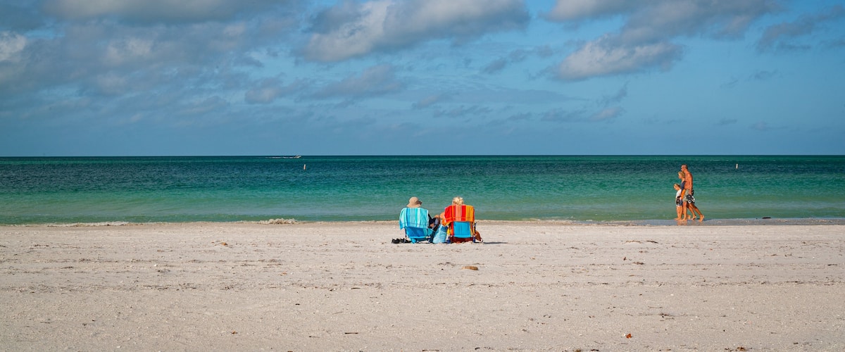 Treasure Island featuring general coastal views and a sandy beach as well as a couple