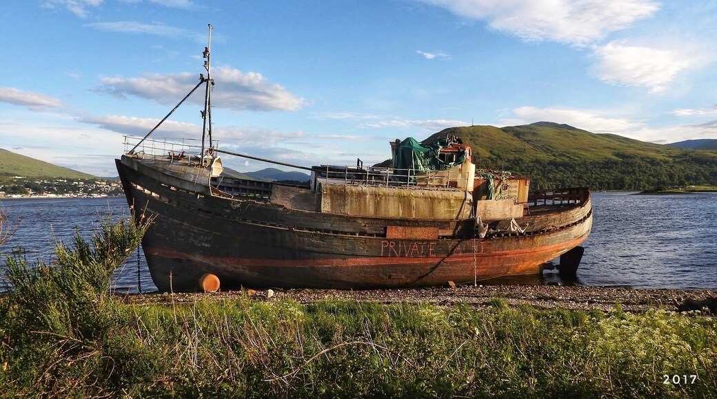 An old ship washed ashore on Loch Linnhe at Fort William on the Higland coast of Scotland.