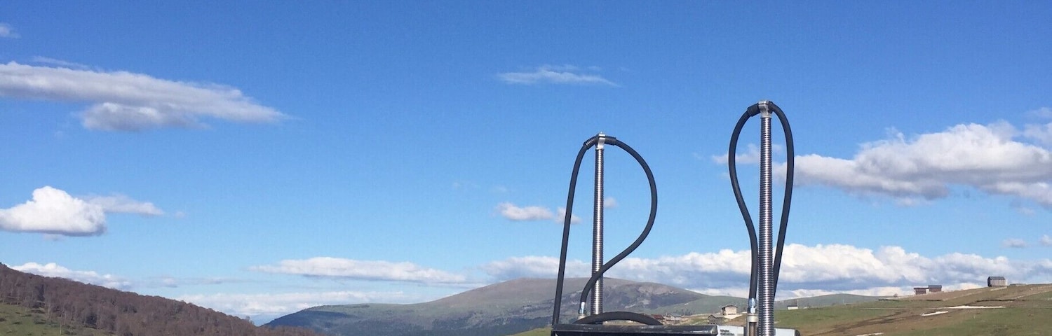 I stopped along this barren and windswept plateau to take of all things, a piss. My hands were freezing and when I was done found this gas pump to be quite oddly placed. There was no road leading to it and no building. Not even the remains of a building. Old farm houses huddled against the wind and cold which never seems to stop at this mountain pass in Georgia.
#georgia #mountainpass #goderdzi #mountains 
Read more on the site: 
 https://www.visa-vis.com/greater-caucasus-travel-blog/republic-of-georgia-living-roots-day-3