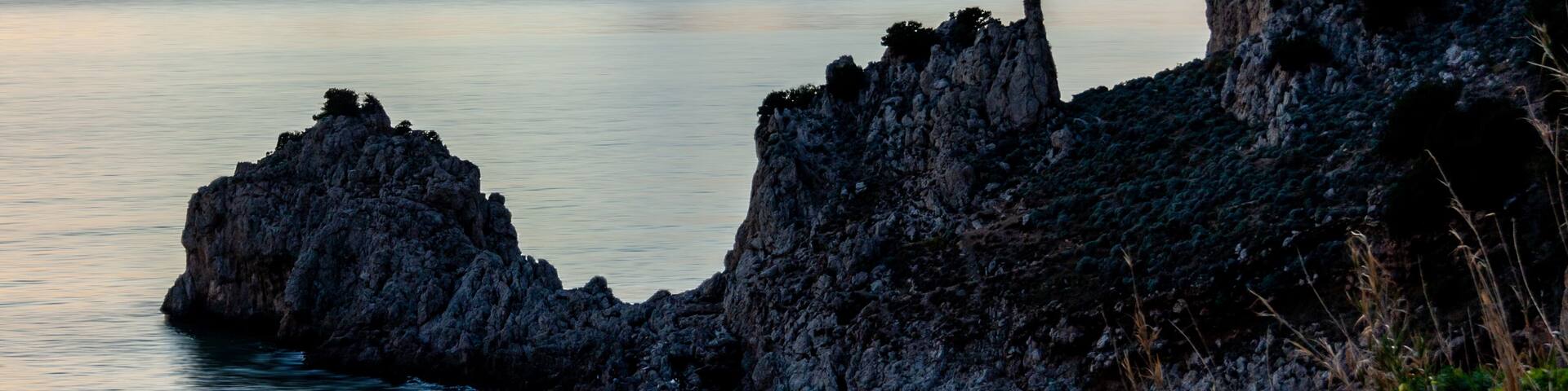Rocky coast of Riviera of Ulysses at Sunset, Sperlonga Italy