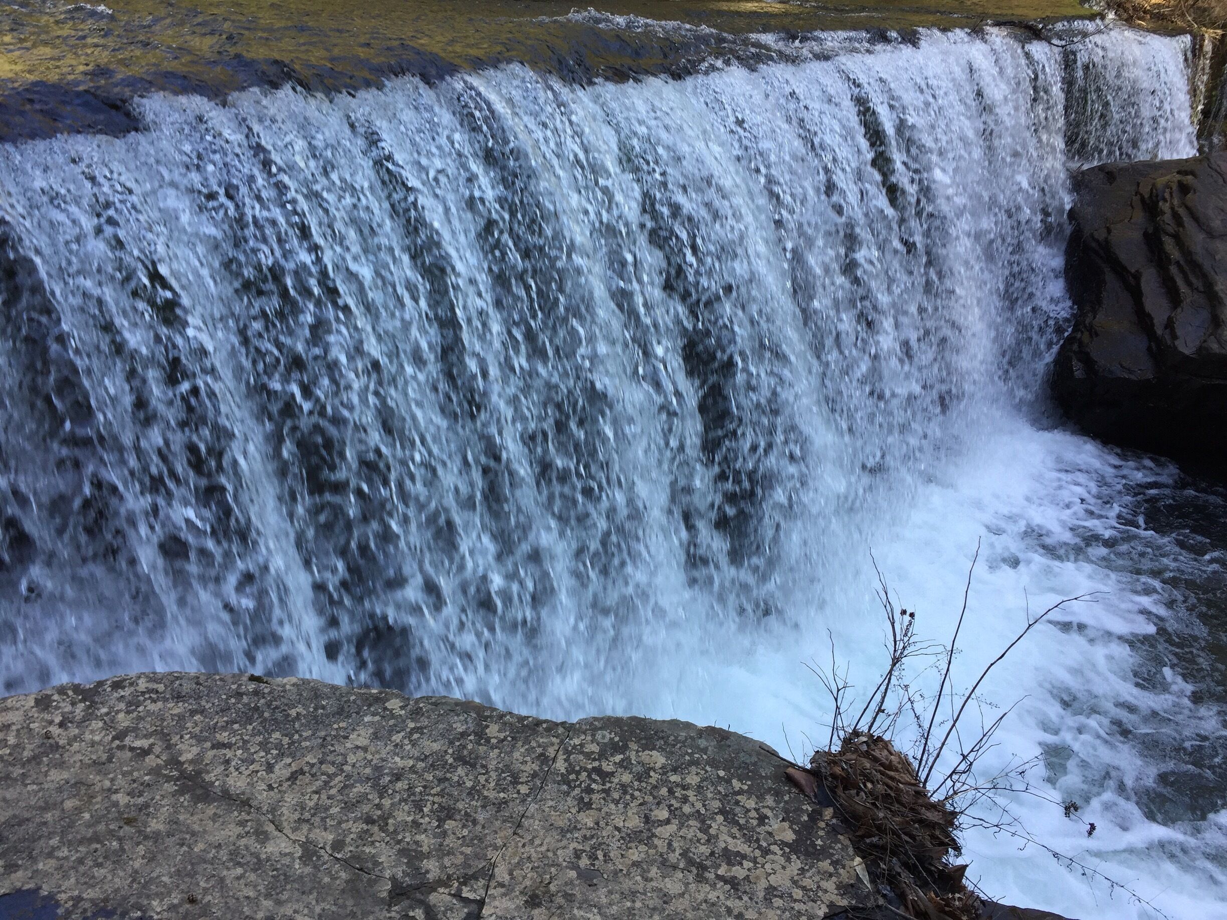 A waterfall cascading over rocks.