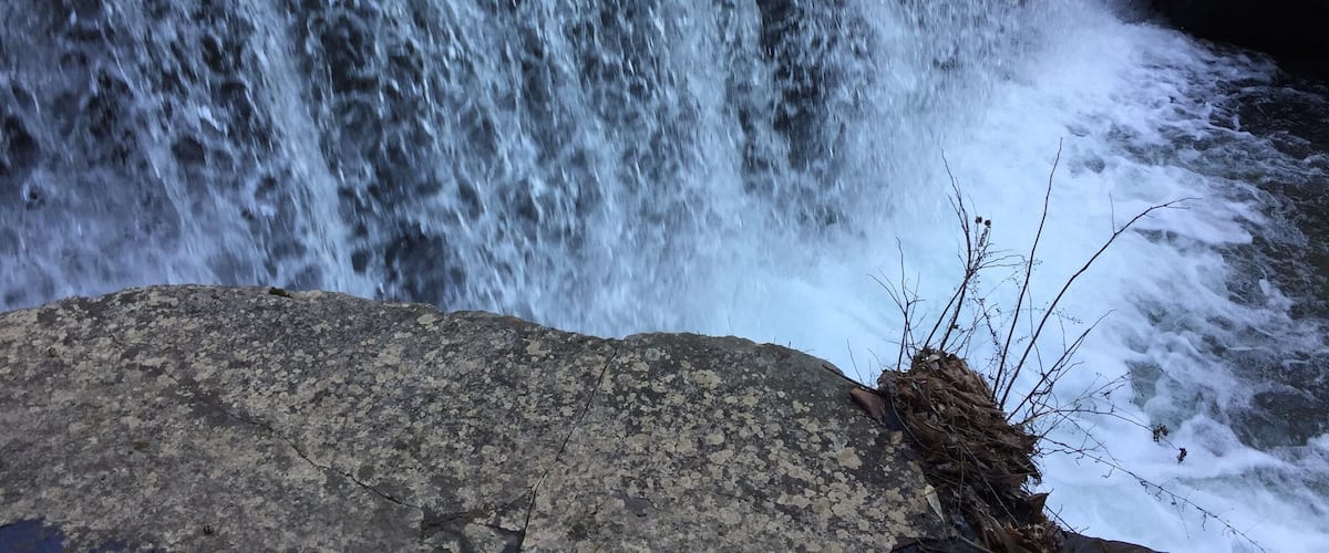 A waterfall cascading over rocks.