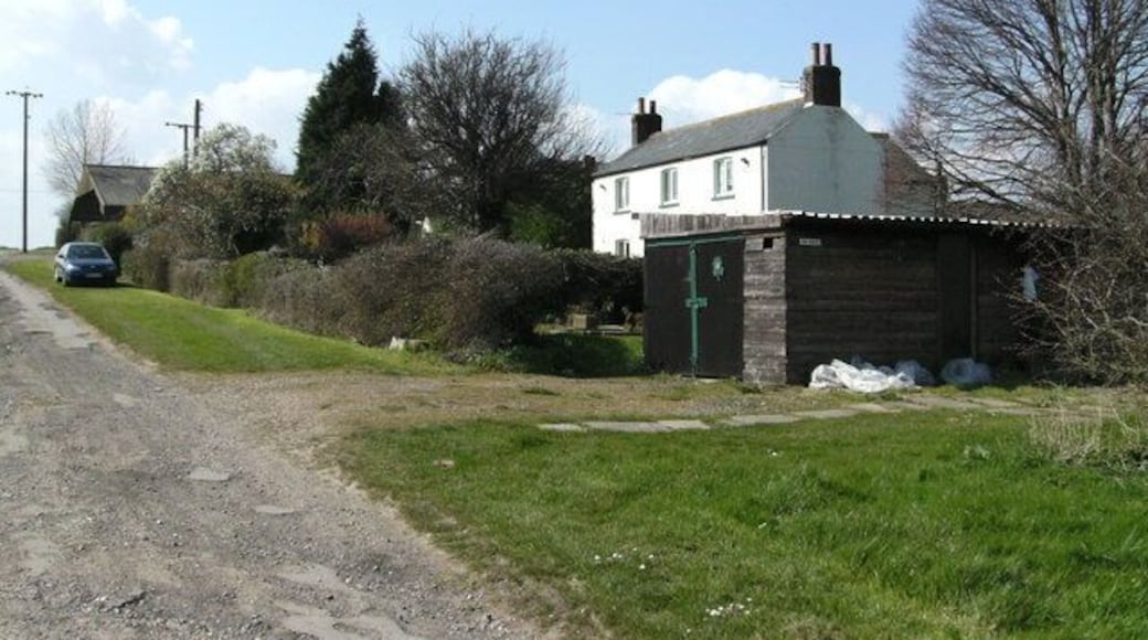 Scrub Holt Farm The rough-looking trackway to the left forms the bridleway to Irby, which climbs for most of its length. Out of sight to the right is a camping/caravanning area.