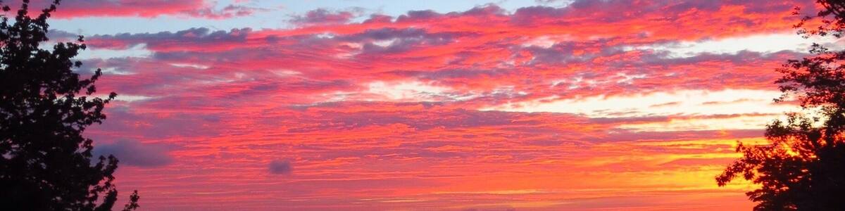 Amazing Late August sunrise from Echo Shores looking east past the tip of Rattlesnake Island toward Wolfboro.