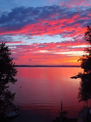 Amazing Late August sunrise from Echo Shores looking east past the tip of Rattlesnake Island toward Wolfboro.