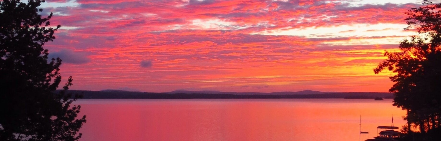 Amazing Late August sunrise from Echo Shores looking east past the tip of Rattlesnake Island toward Wolfboro.