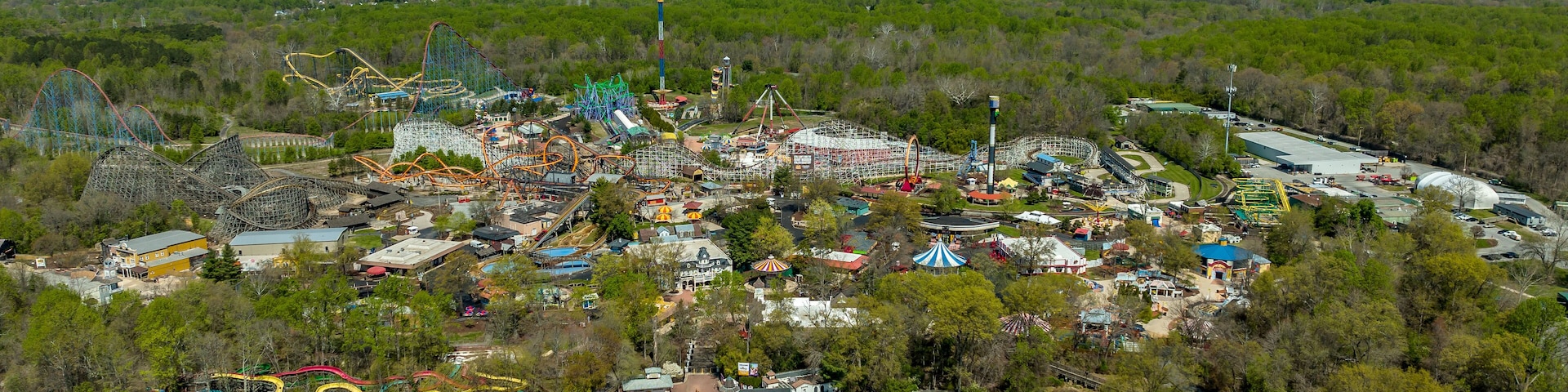 Aerial view of American amusement park with empty rides, roller coasters during the pandemic