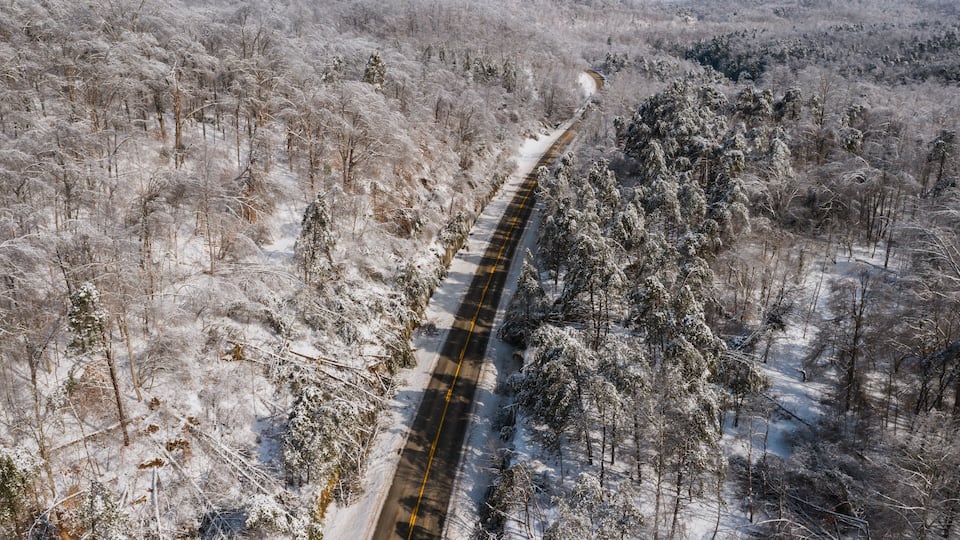 Aerial of KY Route 7 Surrounded by Snow Covered Forests - Grayson Lake State Park - Appalachian Mountains of Eastern Kentucky
