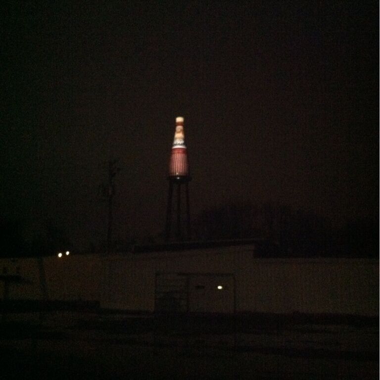This picture accurately captures how sketchy the world's largest catsup bottle is at night. It only has one light on it and I imagine local teenagers hang out under the 100-ft platform (for the 60-ft bottle). But now I have seen it. #condiment #roadside