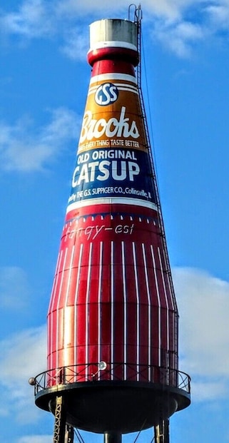 A tall, cylindrical structure with a red and white striped pattern and a label reading "Brock's Old Original Catsup."