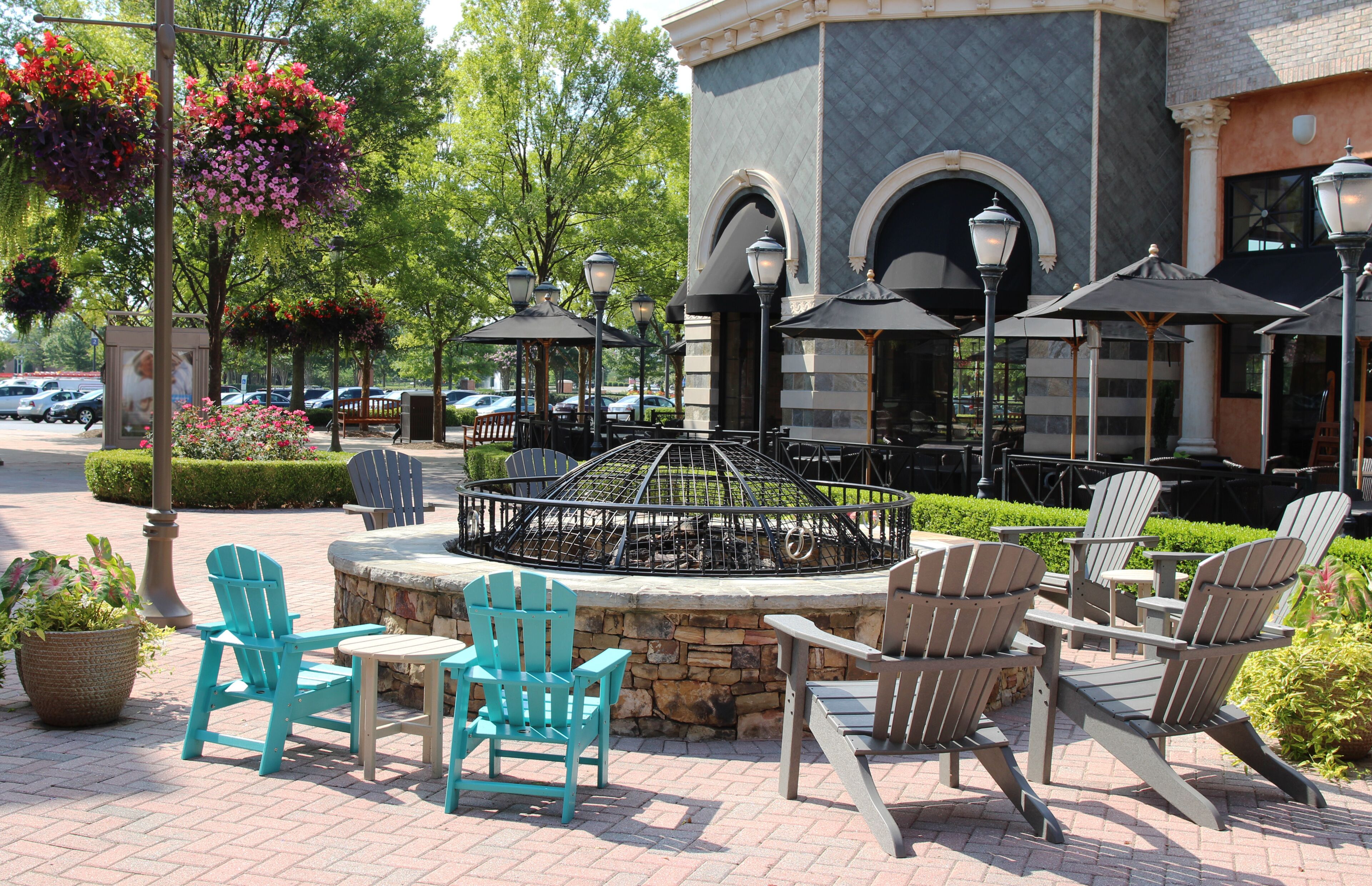 Cast stone fire pit with a protective cover in a public area, Short Pump Town Center, Virginia, USA