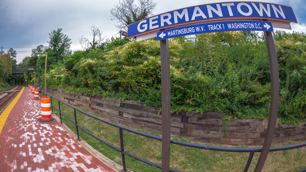 Direction sign in railway station. One city in Montgomery County, Maryland, located approximately 25–30 miles outside of the U.S. capital of Washington, D.C, Germantown, USA