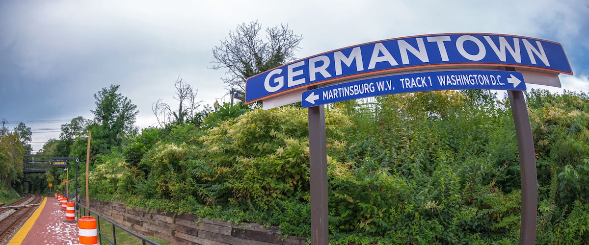 Direction sign in railway station. One city in Montgomery County, Maryland, located approximately 25–30 miles outside of the U.S. capital of Washington, D.C, Germantown, USA