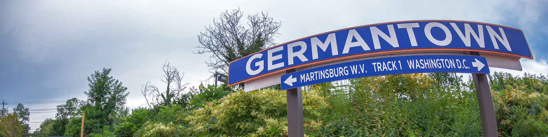 Direction sign in railway station. One city in Montgomery County, Maryland, located approximately 25–30 miles outside of the U.S. capital of Washington, D.C, Germantown, USA