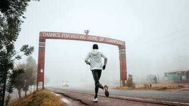 Runner with the inscription Thanks for visiting Iten, home of Champions, running training in Kenya. Marathon running, illustration photo