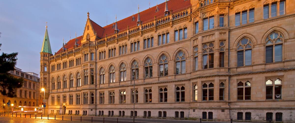 A historic building with ornate architecture and a red-tiled roof.