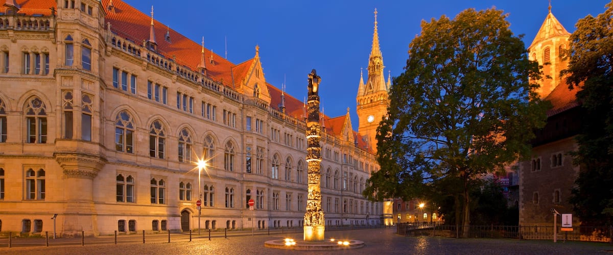A historic building with ornate architecture and a tall tower.