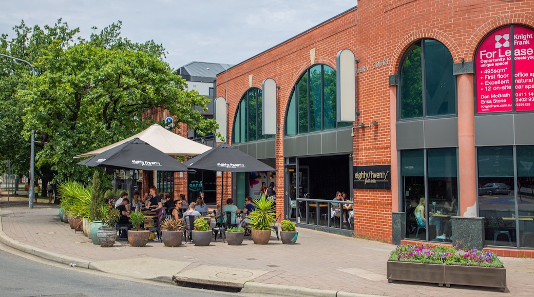 Braddon featuring outdoor eating as well as a small group of people