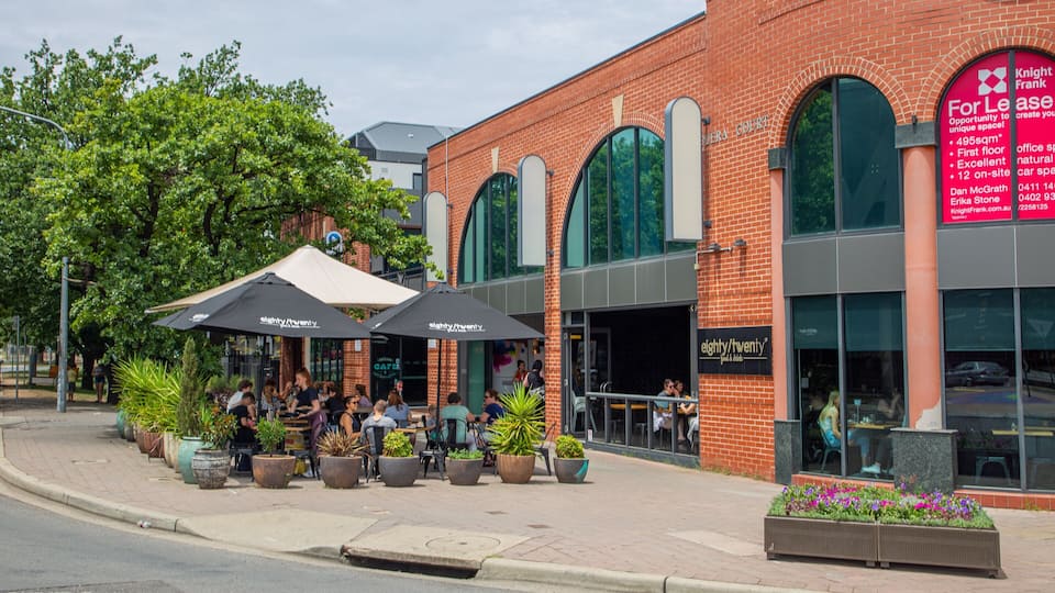 Braddon featuring outdoor eating as well as a small group of people