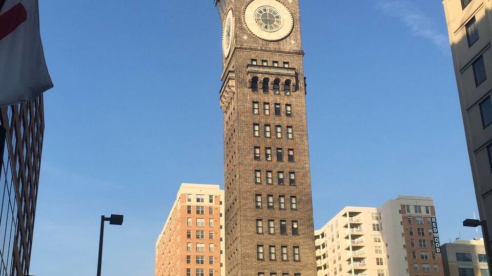 Neat tower attached at bottom to fire station.