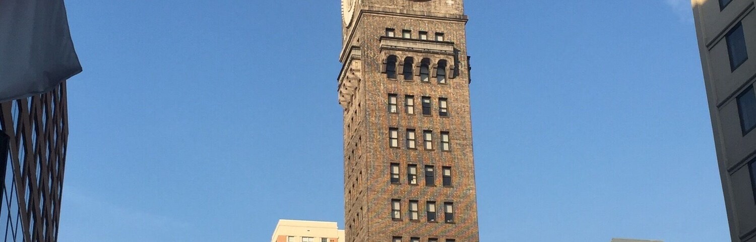 Neat tower attached at bottom to fire station.