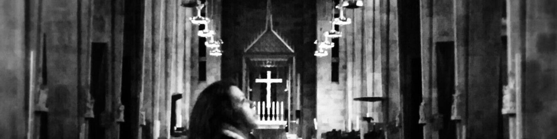 It's difficult not to stand and stare in awe inside the Cathedral of Mary Our Queen. I captured this image of a friend lost in the intricate art of hundreds of stained glass windows lining the cathedral walls.
