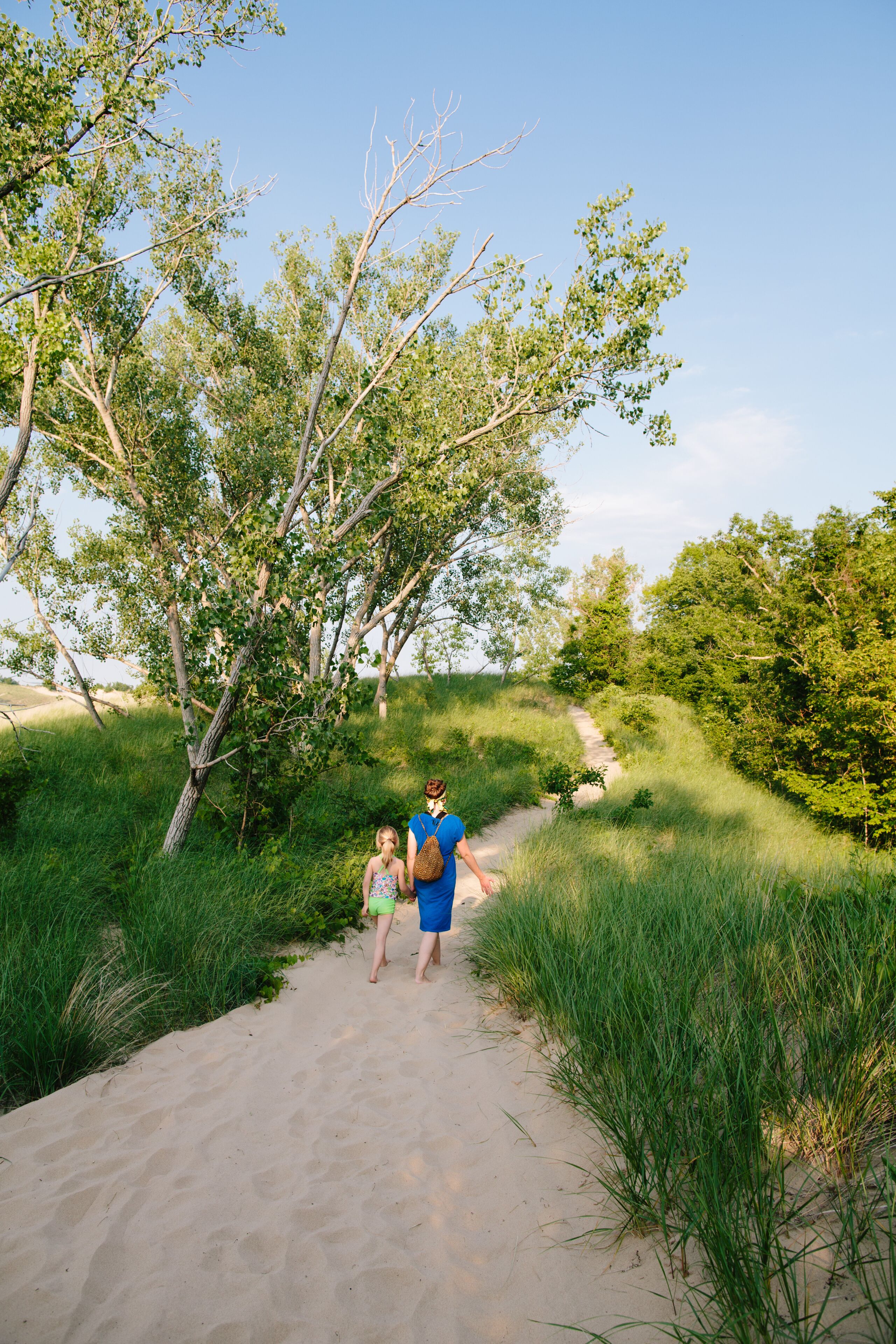 mom and daughter walk at Warren Dunes State Park