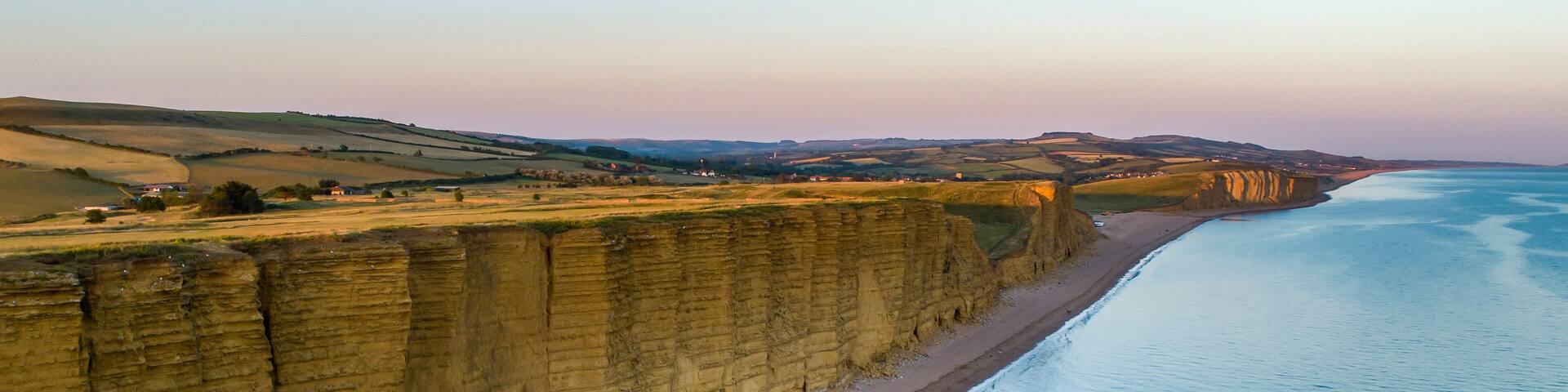 Drone image of hot of the beach and cliffs in West Bay