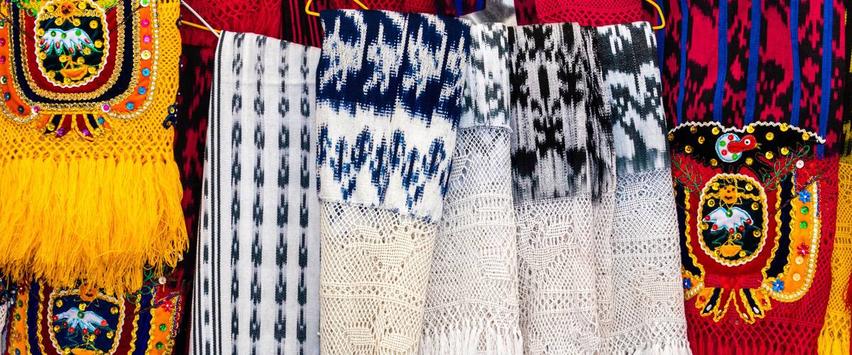 Scarves or makans from Ecuador at the market made using a technique called ikat and knitting. Traditional craft and design for Gualaceo canton, Azuay province.