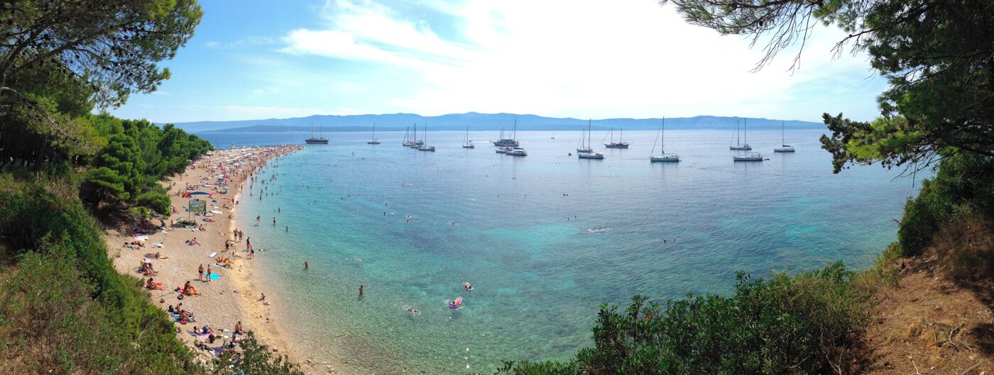 Zlatni Rat near Bol, Croatia is one of the most uniquely shaped beaches I have ever encountered. The V-shaped white pebble beach backs up to a lovely pine grove, offering the perfect shade for those looking for some natural cover from the sun. The water is calm and crystal clear. The beach itself extend out about 630 meters, but the shape of the spit varies greatly depending on the currents, tide and wind. While it can be a bit crowded mid-day during the high season, if you head to Zlatni Rat first thing in the morning or late in the afternoon, you'll have the entire beach to yourself. #beach