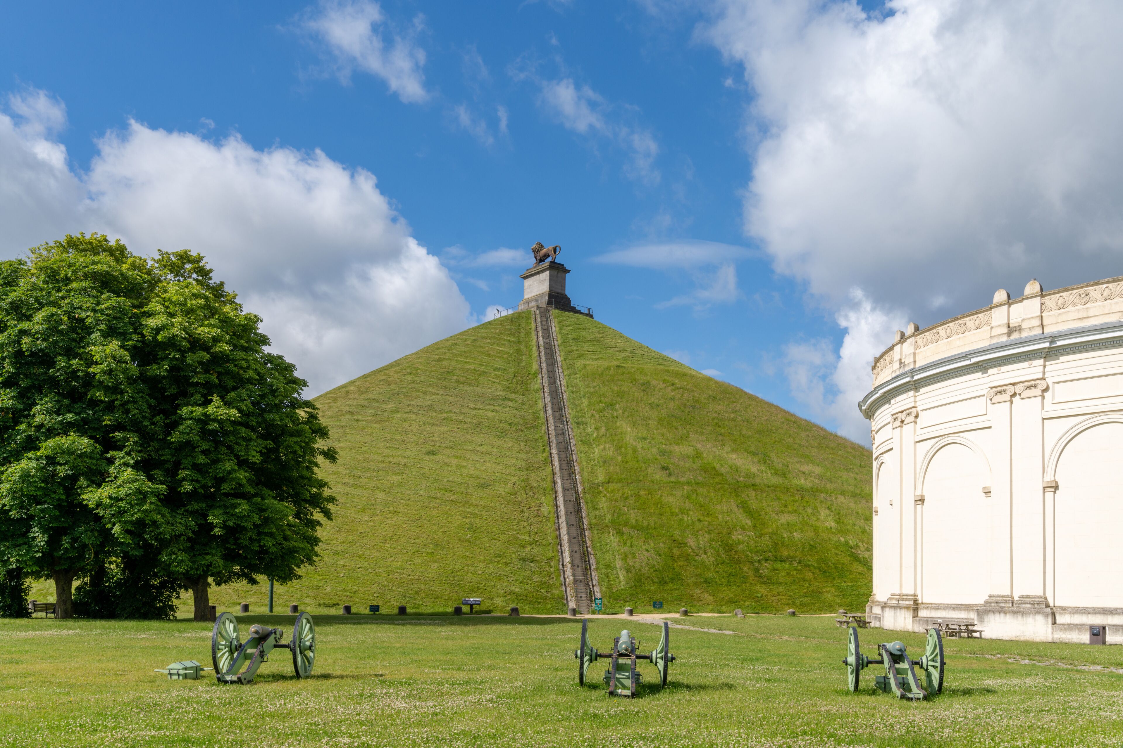 view of the Lion's Mound and cannons at the Waterloo Battlefield Memorial outisde of Brussels
